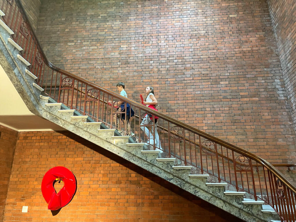 Children climbing staircase at Maitland regional art gallery