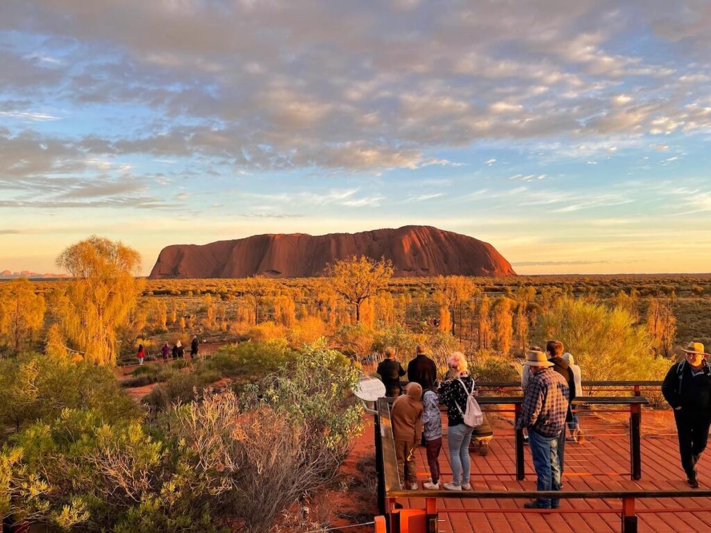 People at the viewing platform at Uluru sunrise