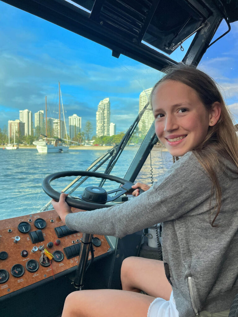 Girl driving the boat Aquaduck Gold Coast