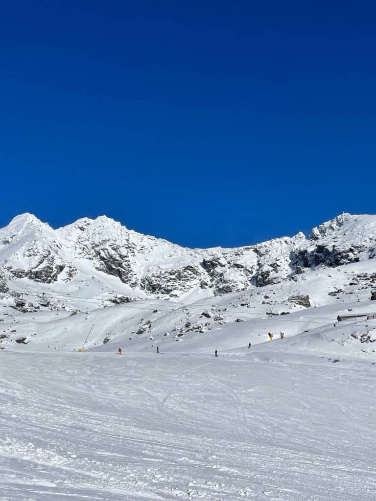 Ski slopes and blue sky. 