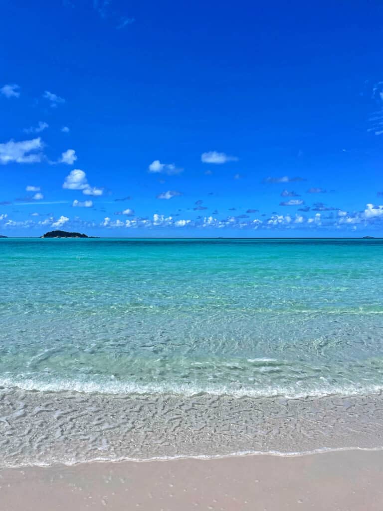 Clear blue water of Whitehaven Beach.