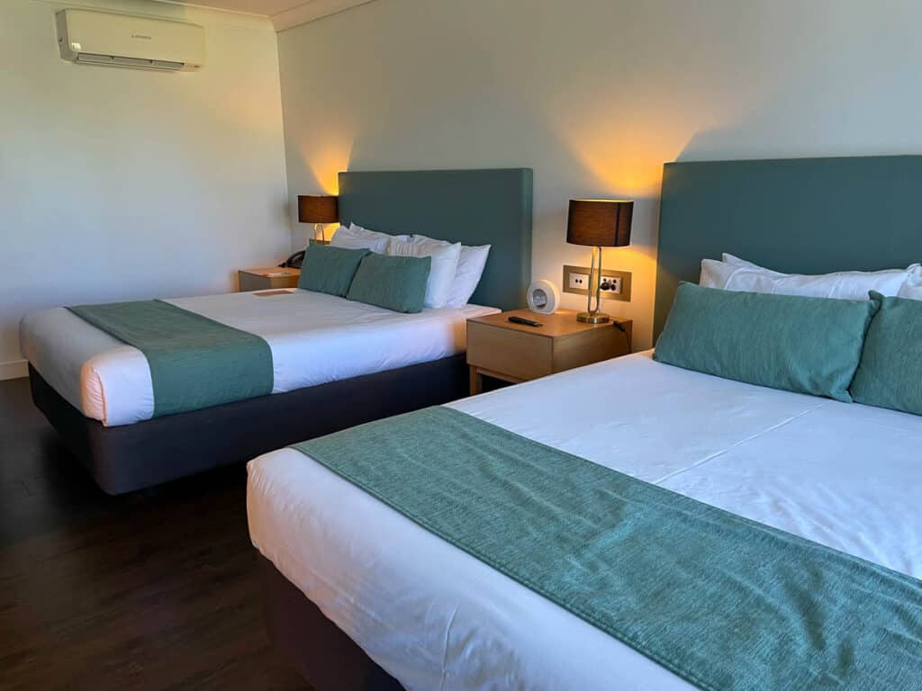 Interior of Daydream Island Resort bedroom showing two queen beds