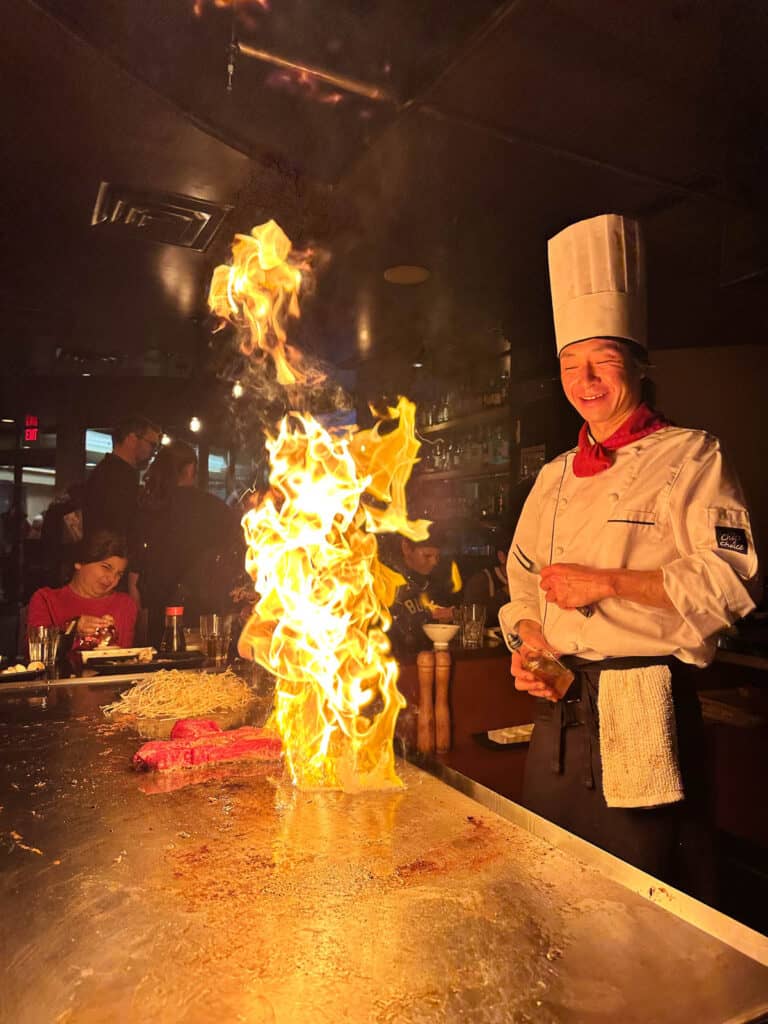 Chef at Teppan Village Whistler with flames. 