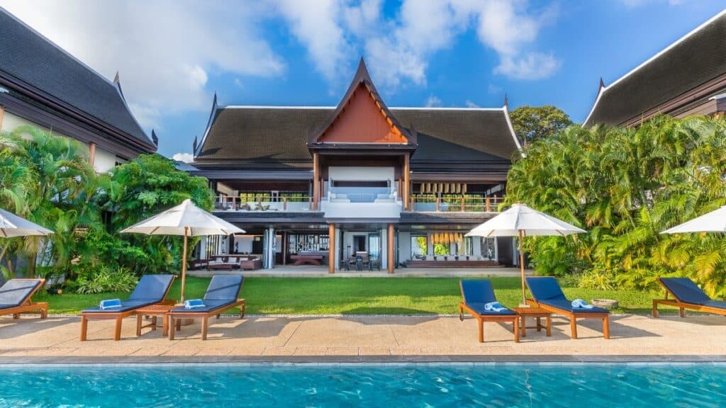 Large family villa in Phuket with lawn and swimming pool.