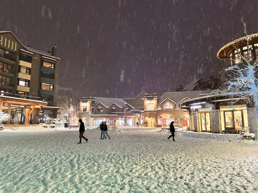 Whistler Village square covered in snow.