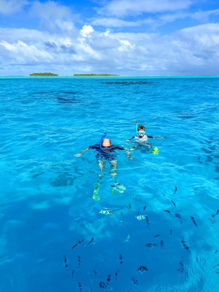 People snorkelling in the Cook Islands.
